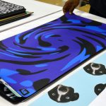 Stack of Real Custom Desk Mats